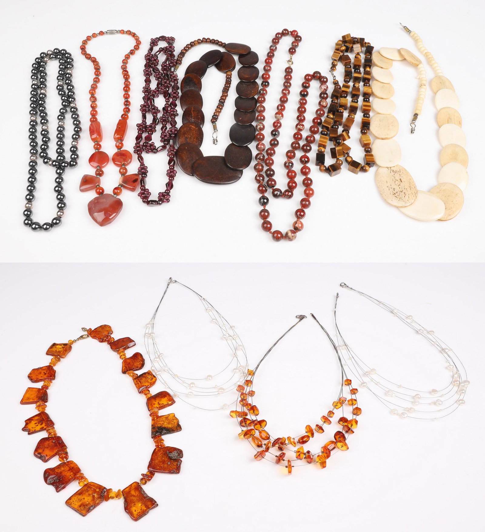 (11) Amber, Pearl and Stone Necklaces: (11) Amber, Pearl and stone necklaces to include amber multi-strand necklace, amber statement necklace, (2) multi-strand pearl necklaces, (2) bone statement necklaces and (5) semi-precious stone neckl