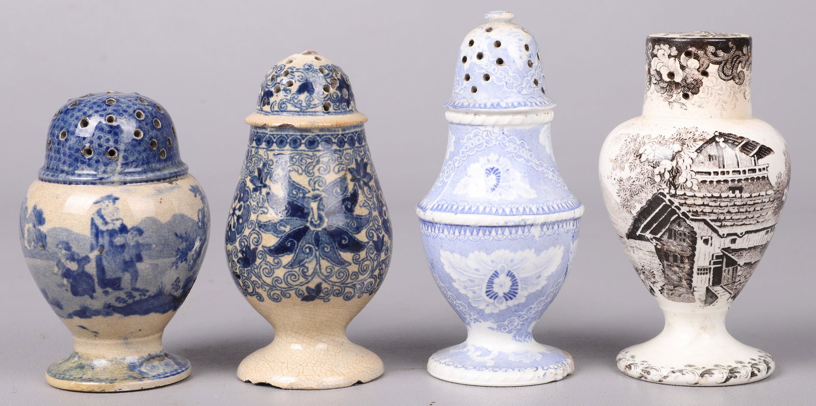 (4) Mid 19th C Transfer Decorated Pepper Pots: (4) Mid 19th C transfer decorated pepper pots to include scenic blue and white pot in farm and family decorated surround, 3-3/4"H, blue and white floral transfer decorated pot, chips to lid and foot, 