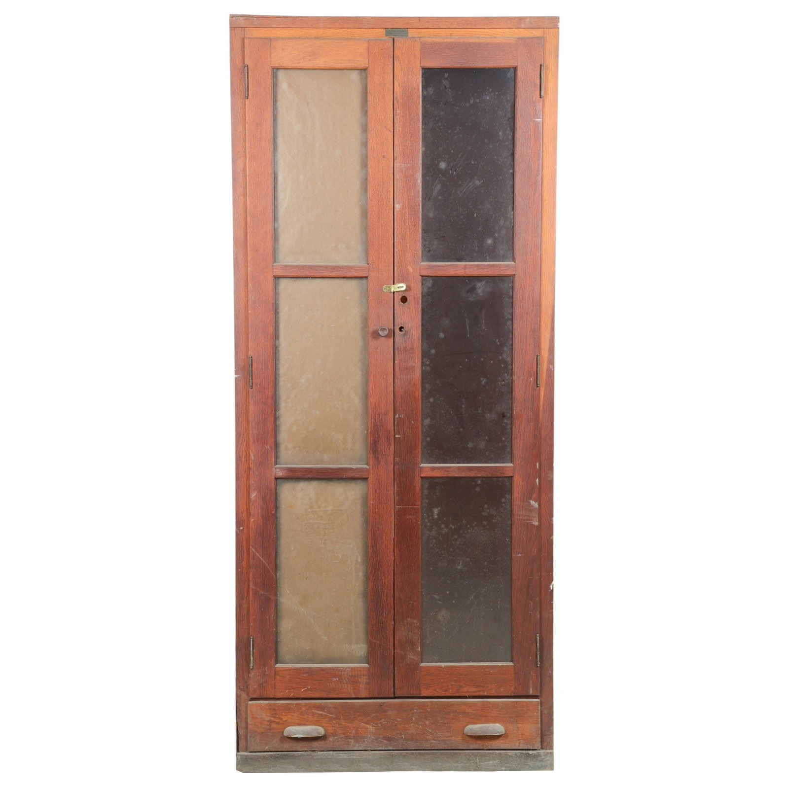 Oak paneled 2-door bookcase: Oak paneled 2-door bookcase, paneled glass doors, interior shelving, lower drawer, 84"h x 36"w x 18"d