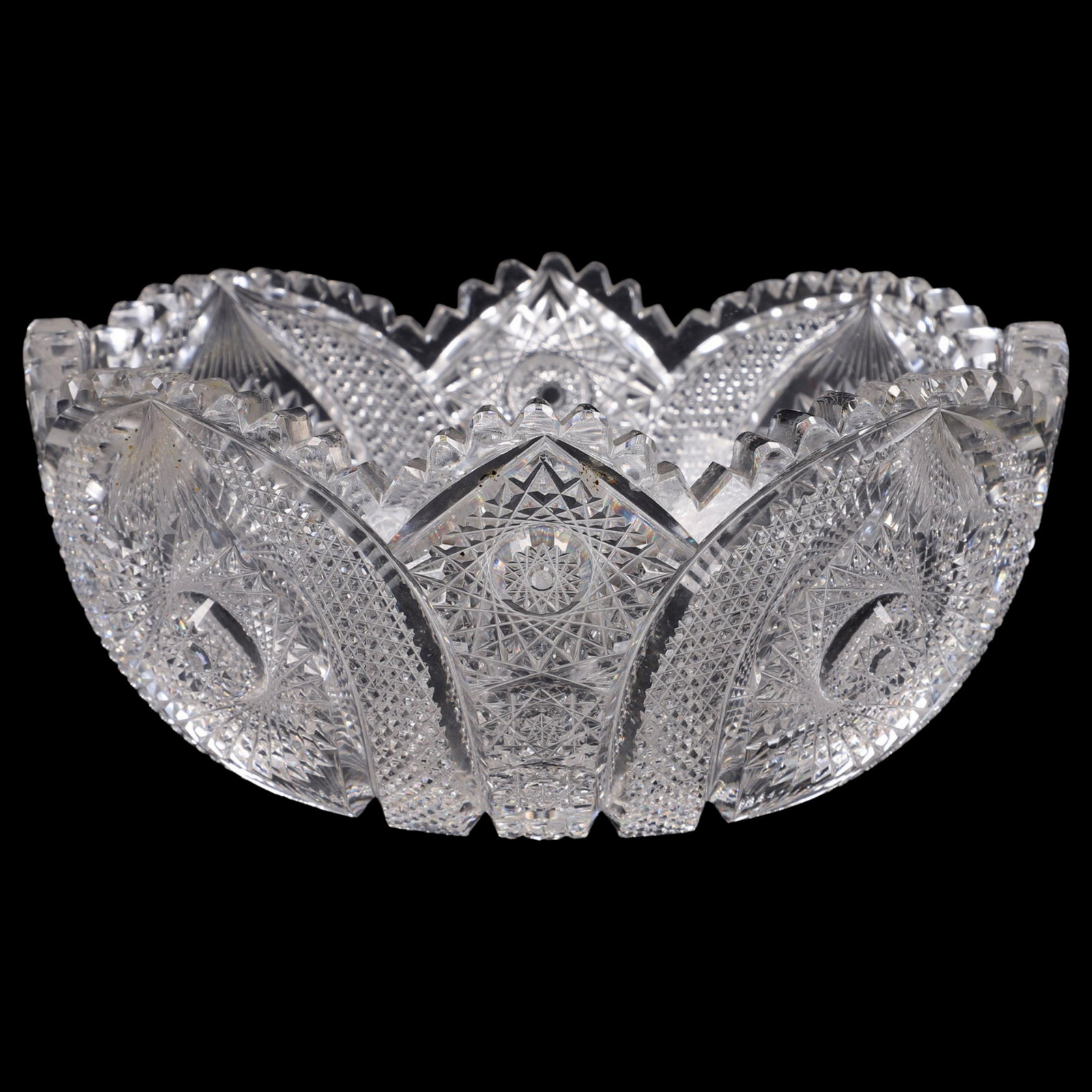 Intricate Cut Glass Bowl: Intricate cut glass bowl, 9" dia x 4-1/8" h, minor chips to teeth, Some minor interior fleabites, no major chips, or cracks.