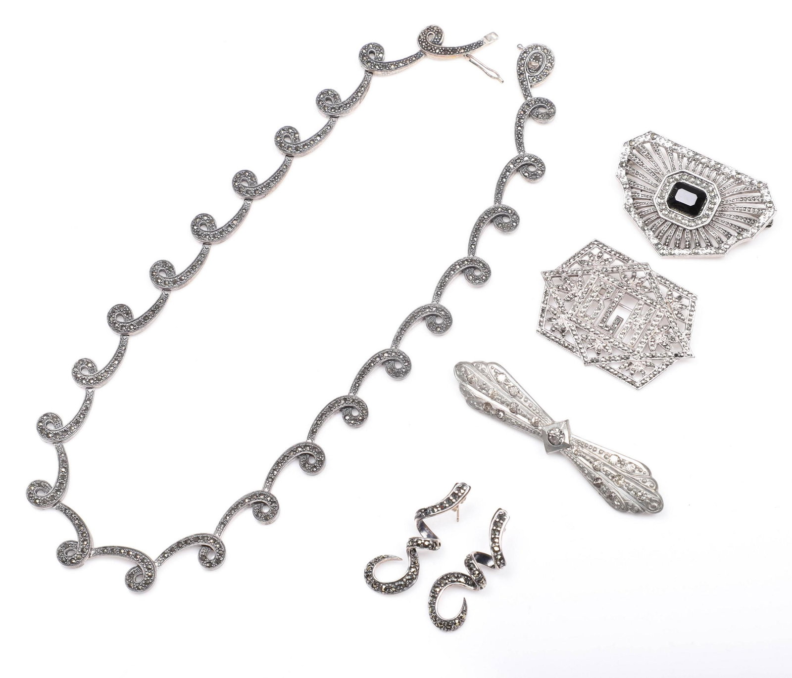 Sterling and Style Jewelry Group: Sterling and style jewelry group to include sterling marcasite loop necklace, 17"L, sterling marcasite loop post earrings, sterling marcasite 'BLM' monogram brooch and (2) silvertone brooches.