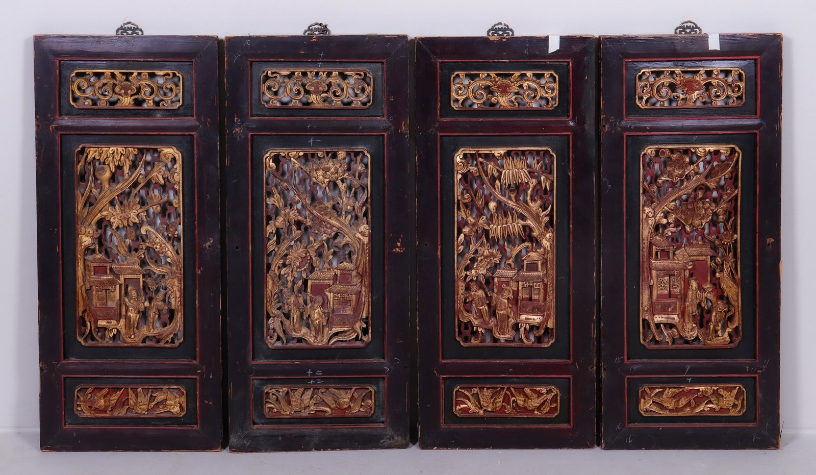 (4) Chinese carved wood panels: (4) Chinese carved wood panels, gilt figures in landscape, 33-1/4" x 15-1/8"
