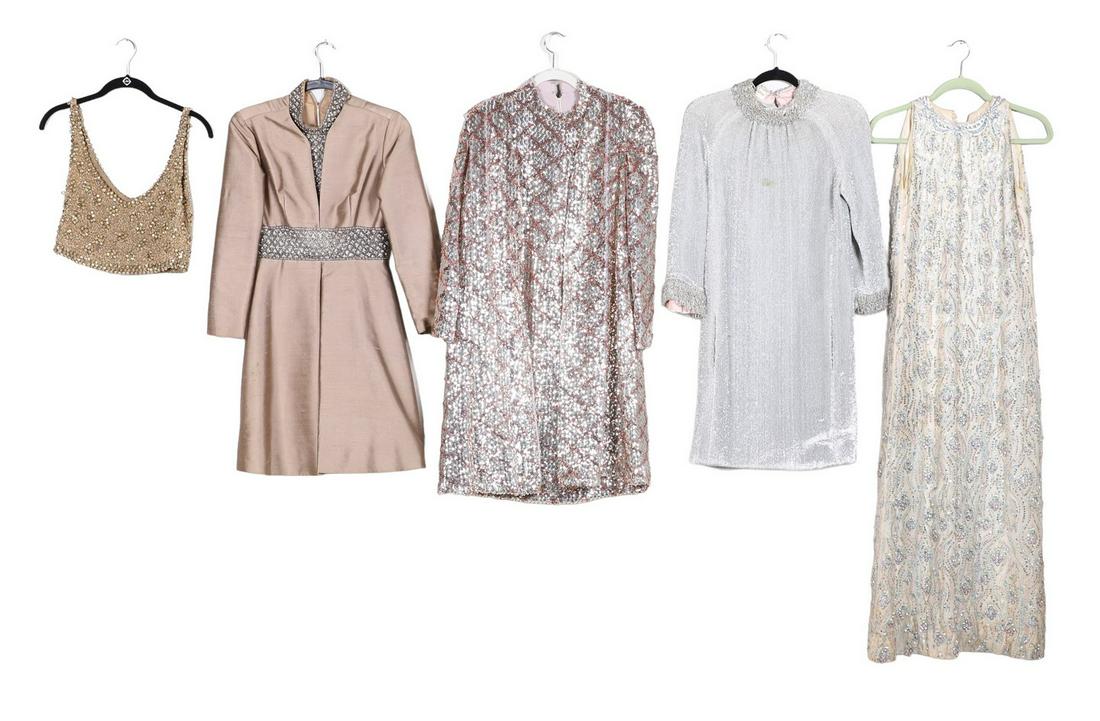 (5) 60's/70's Sequined and Beaded Garments: (5) 60's/70's Sequined and beaded garments to include fully sequined and rhinestone studded maxi dress, sleeveless, Anne Cohen Glick silver cocktail dress, beaded neck and cuffs, spot stain to front,