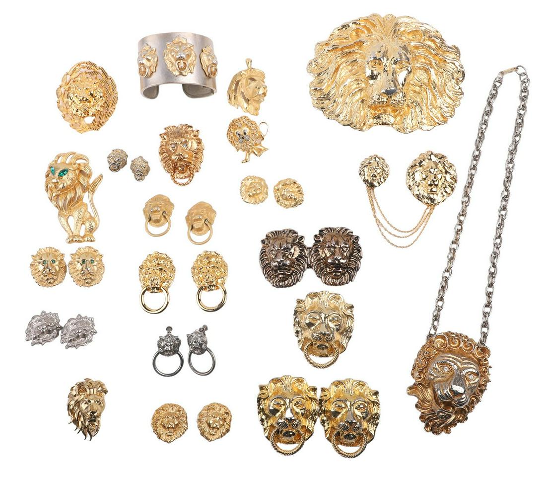 Costume Lion Jewelry Grouping: Costume Lion jewelry grouping to include lion face brushed gold tone clip earrings, rhinestone eye gold tone embossed lion head clip earrings, hinged lion studded bangle, some imperfections, lion head
