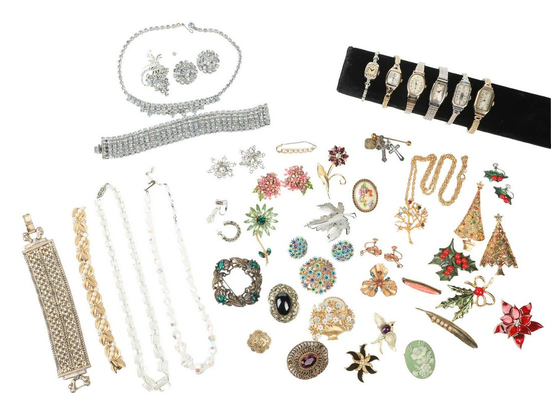 Costume Jewelry and Watch Grouping: Costume jewelry and watch grouping to include 60's floral bloom brooch and earring suite, (2) Trifari Christmas tree brooches, Regal Gems costume tree of life necklace, Limoges floral painted porcelai