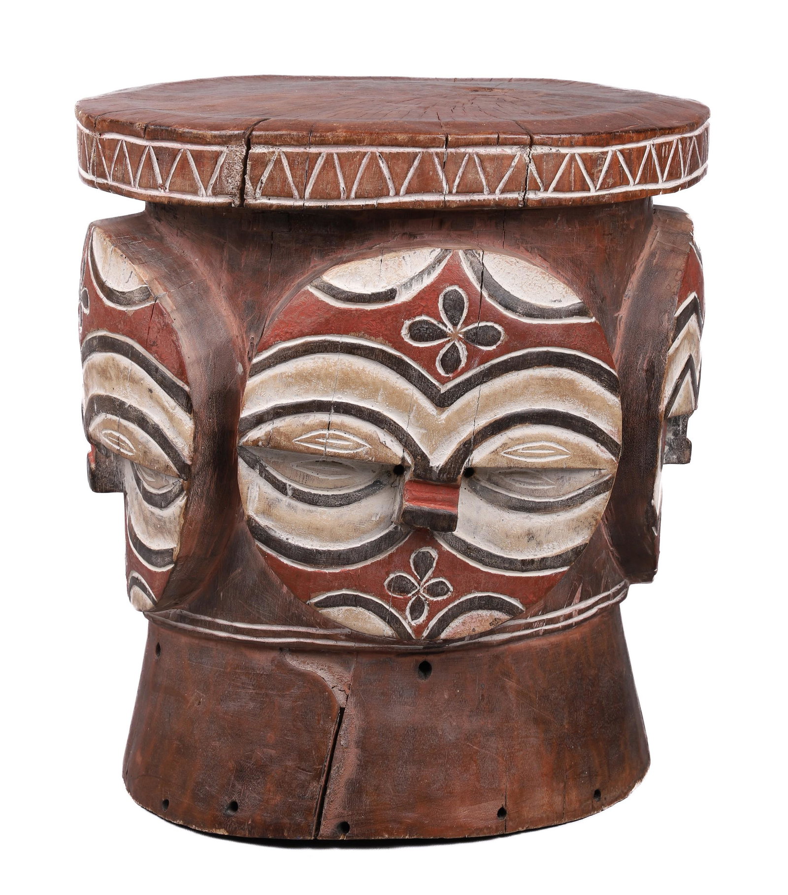 African Carved Wood Stool: African carved wood stool, geometric masks carved in base, 12-3/4" x 11-3/4" x 213-3/4" h, natural splits in wood to top