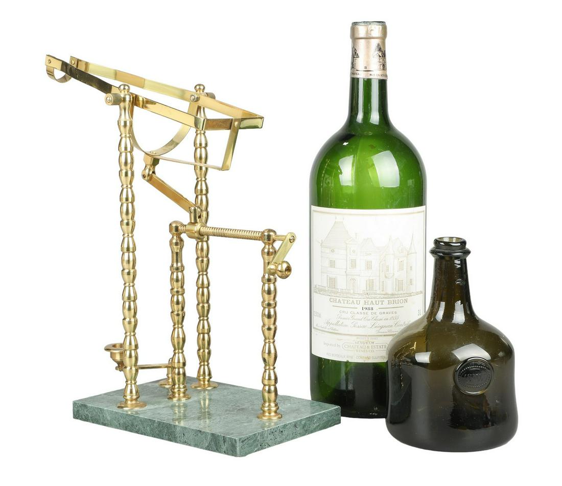 Brass Mechanical Wine Pourer: Brass mechanical wine pourer, mounted on green marble base with crank dispense and swivel candle stand for light, 14"H, 15"D, 6-1/2"W, permits bottle 3-3/4"W, neck taper begins at 9-1/2" h of bottle, 
