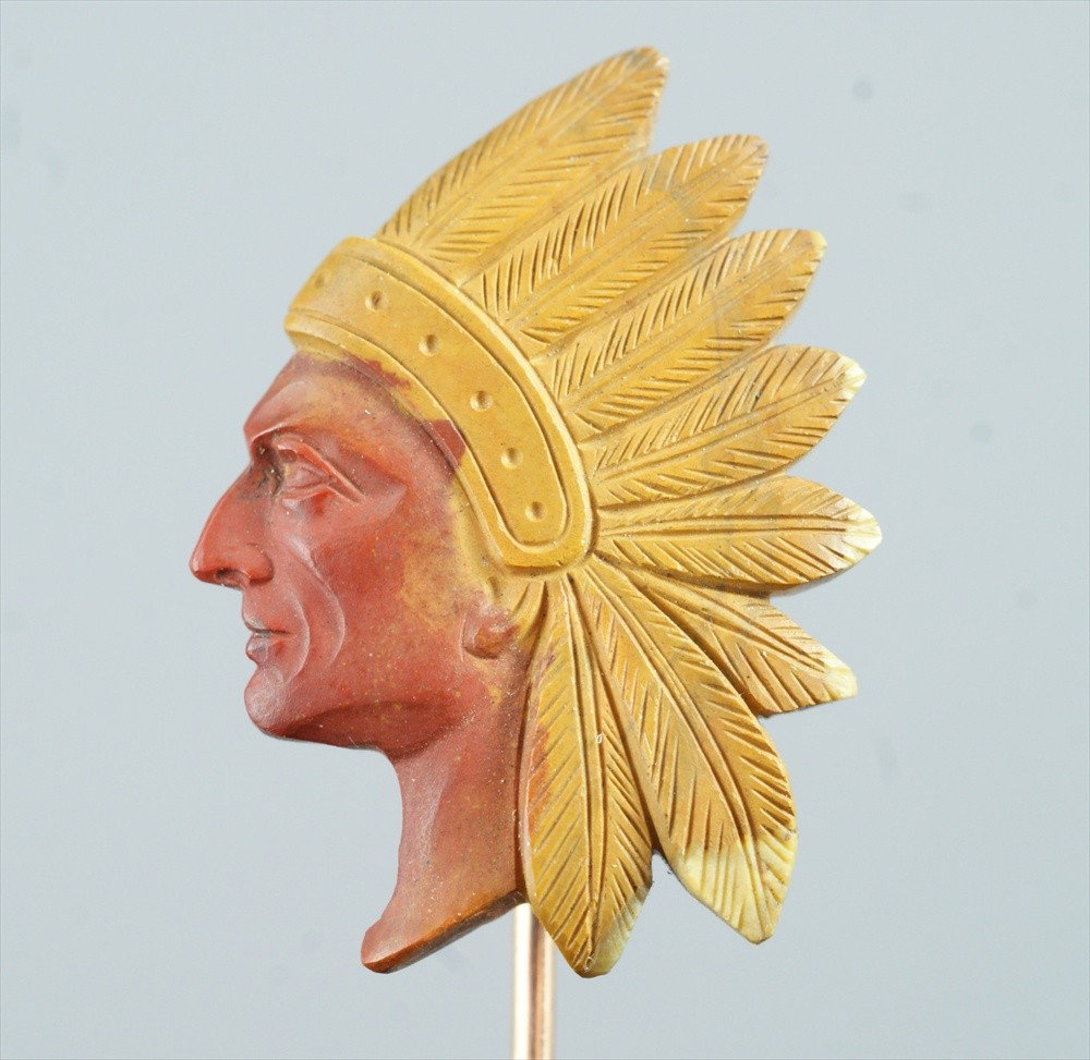 Carved stone Native American stickpin, on an unm: Carved stone Native American stickpin, on an unmarked YG pin