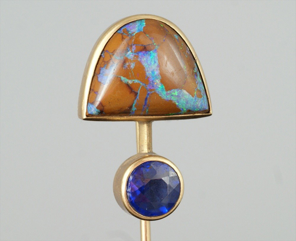 Unmarked YG stickpin, arched 16 mm wide opal ove: Unmarked YG stickpin, arched 16 mm wide opal over a pale blue faceted 8 mm stone