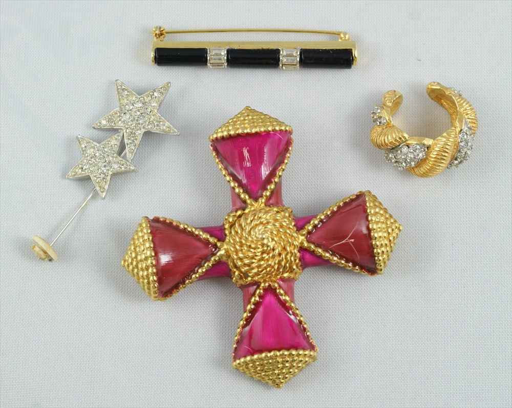 4 piece Kenneth Lane costume jewelry lot consist: 4 piece Kenneth Lane costume jewelry lot consisting of gold tone pink enamel cross pin, 3" L, signed, gold tone black stone and rhinestone bar pin, 2" L, signed, silver tone rhinestone star stick pin,