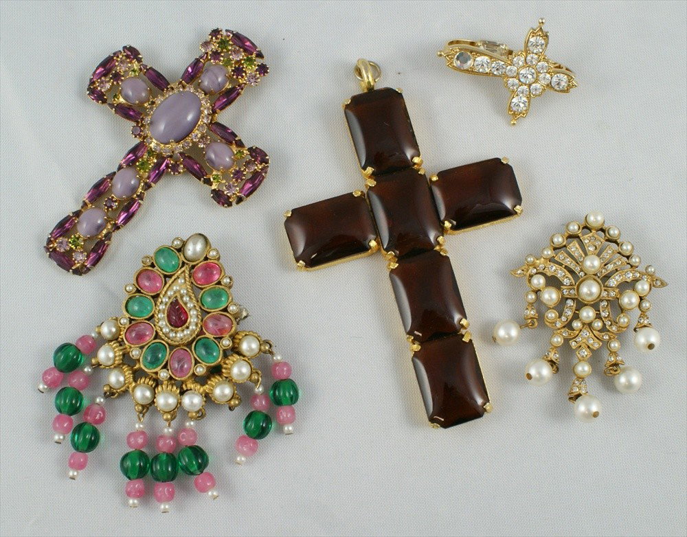 5 piece costume jewelry lot consisting of Zoe Co: 5 piece costume jewelry lot consisting of Zoe Coste rhinestone cross, 1.5"L, Cadoro gold tone glass stone cross pendant, 4" L, Cadoro gold tone faux pearl and rhinestone drop brooch, 2"L, gold tone pi