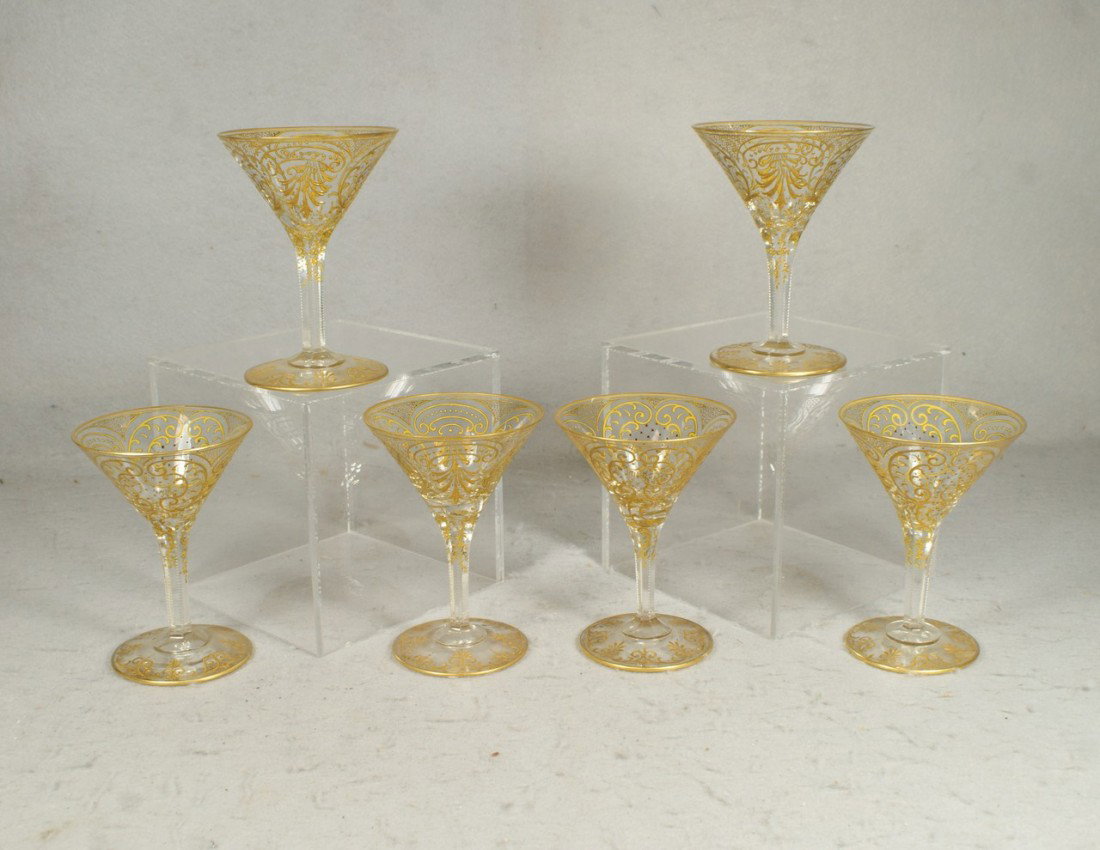 (6) Moser gilt enameled champagne saucers, signe: (6) Moser gilt enameled champagne saucers, signed Moser Glasfabrik, Carlsbad, Austria, 1 with shallow chip, 5 1/4" tall, 3 3/4" d