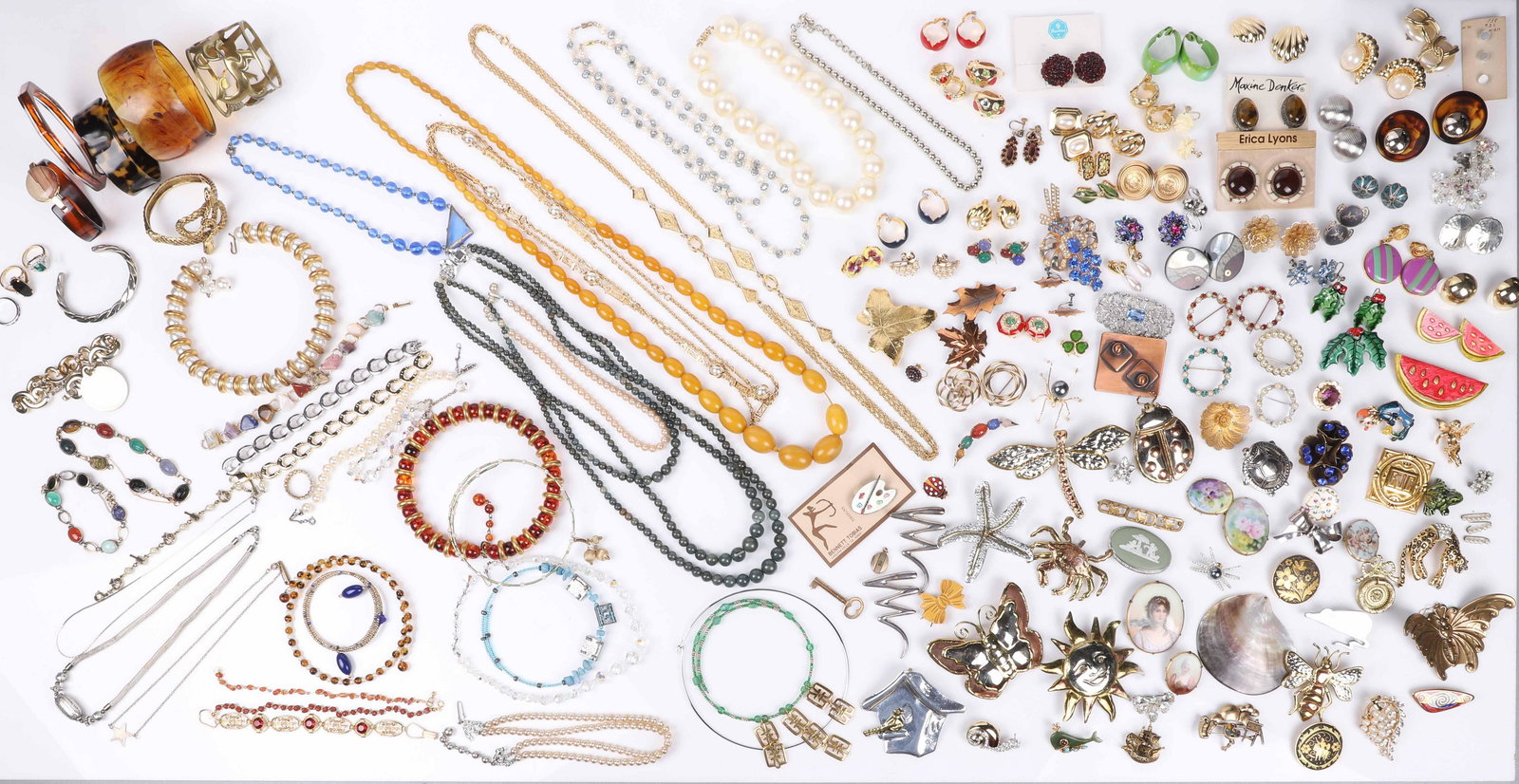Costume and Vintage Jewelry Group: Costume and vintage jewelry group to include fauze tortoise articles, amber earrings and possibly amber necklace, brooches, necklaces, Florenza brooch, porcelain brooches, double headed snake hinged b