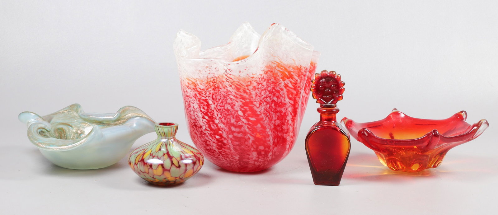 (5) Art Glass Articles: (5) Art glass articles to include oversized napkin vase, 8-1/2"H, Murano lobed bowl, 8-1/4" dia, unsigned art glass low vase, 3-3/8"H, orange art glass bowl, 8" dia and art glass sun stoppered bottle,