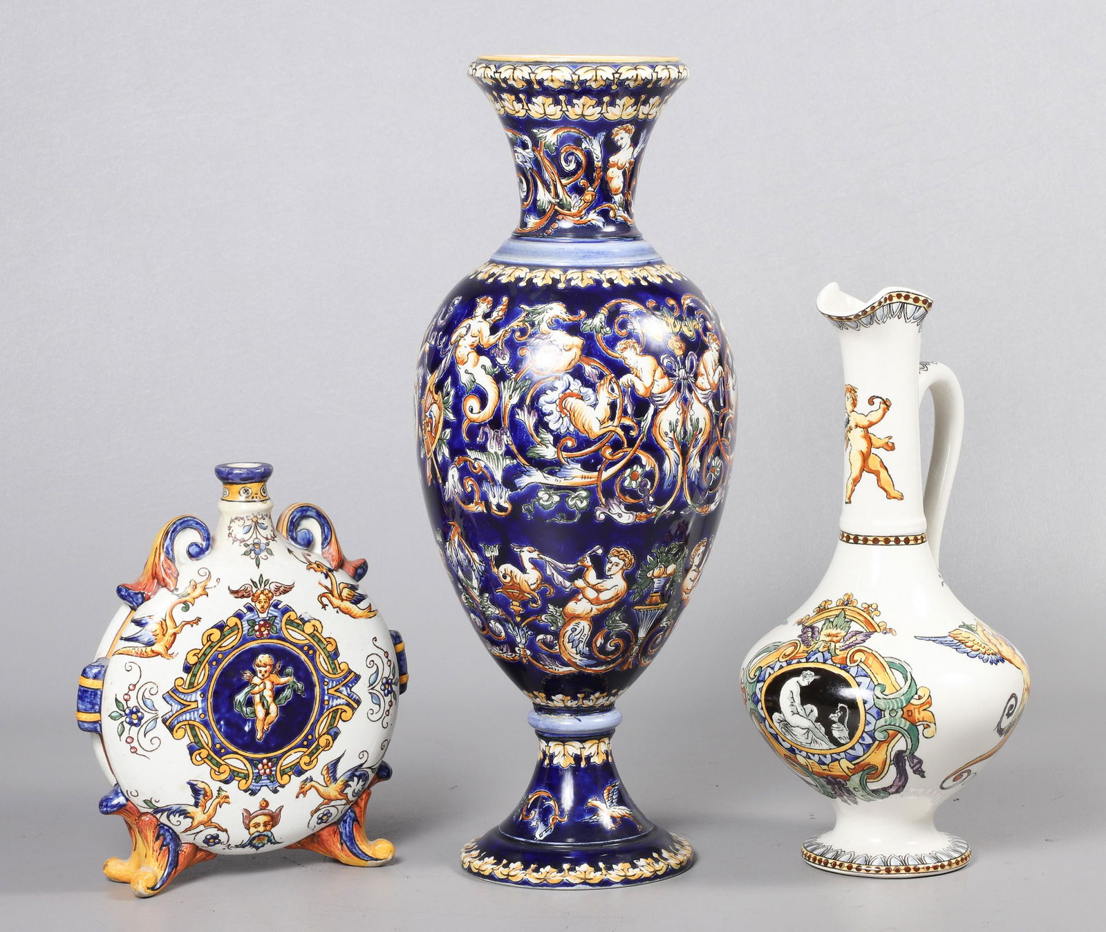 (3) Gien France Pottery Pieces: (3) Gien France pottery pieces to include baluster vase, 14-1/4"H, moon flask vase, 7-1/4"H and ewer, 10-1/4"H, The tall blue one base has old repair, has been reattached.