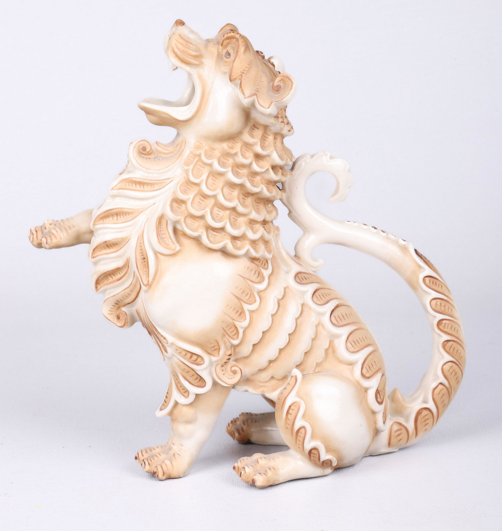 Rudolstadt Straus Porcelain Figural Pitcher: Rudolstadt Straus Porcelain Figural Pitcher of a lion passant, tail as handle, 7-1/2"H, some chipping to fangs, 1900-1918
