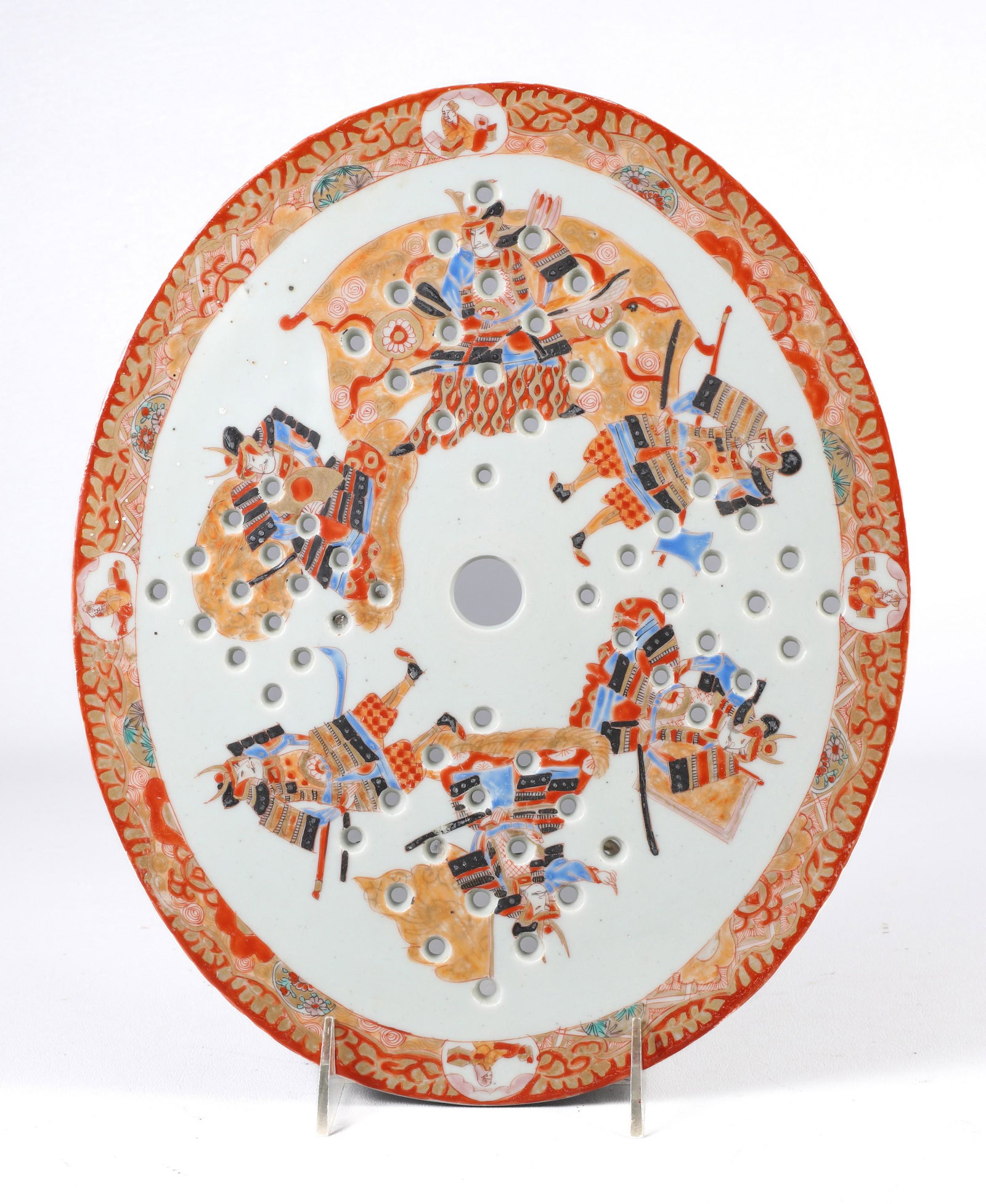 Japanese Porcelain Pierced Trivet Strainer: Japanese porcelain pierced trivet strainer, warrior decoration, calligraphy to base, 12-1/4" x 10"