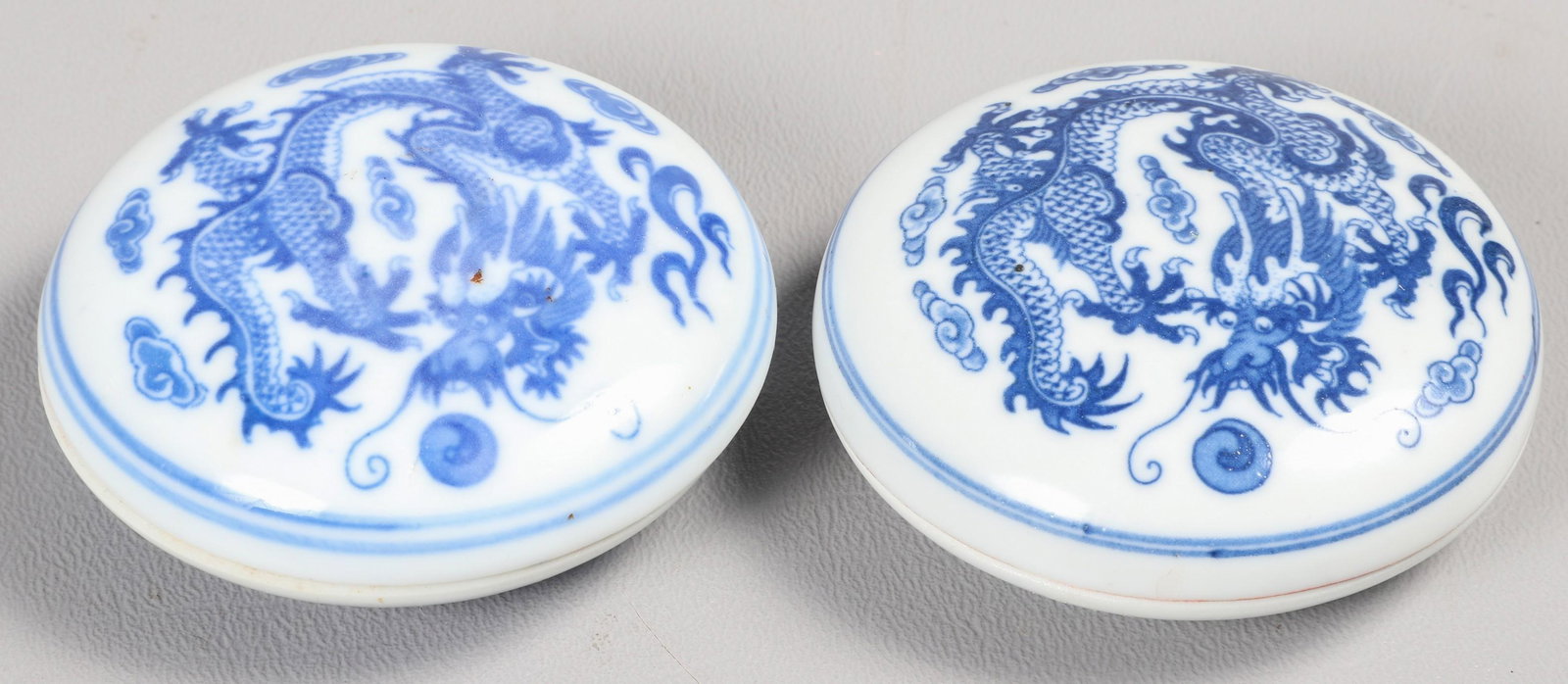 Pair of Chinese Porcelain Ink Boxes: Pair of Chinese blue & white porcelain ink boxes, dragon decoration, 4-character mark to base, 2-1/2" dia