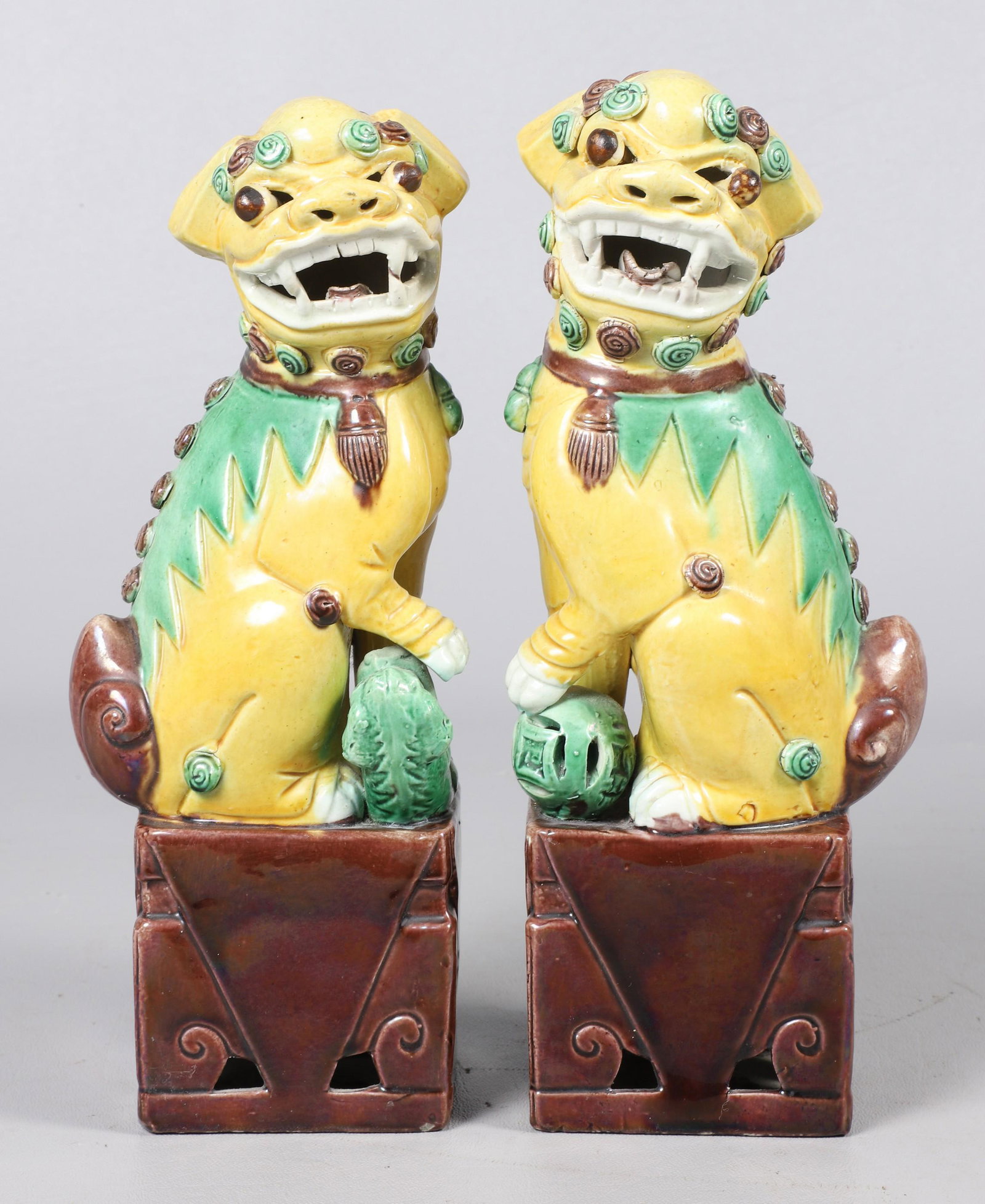 Pair of Chinese Porcelain Foo Dogs: Pair of Chinese porcelain foo dogs, yellow & green glaze, marked Ã¢€Å“China", 9-1/2" h