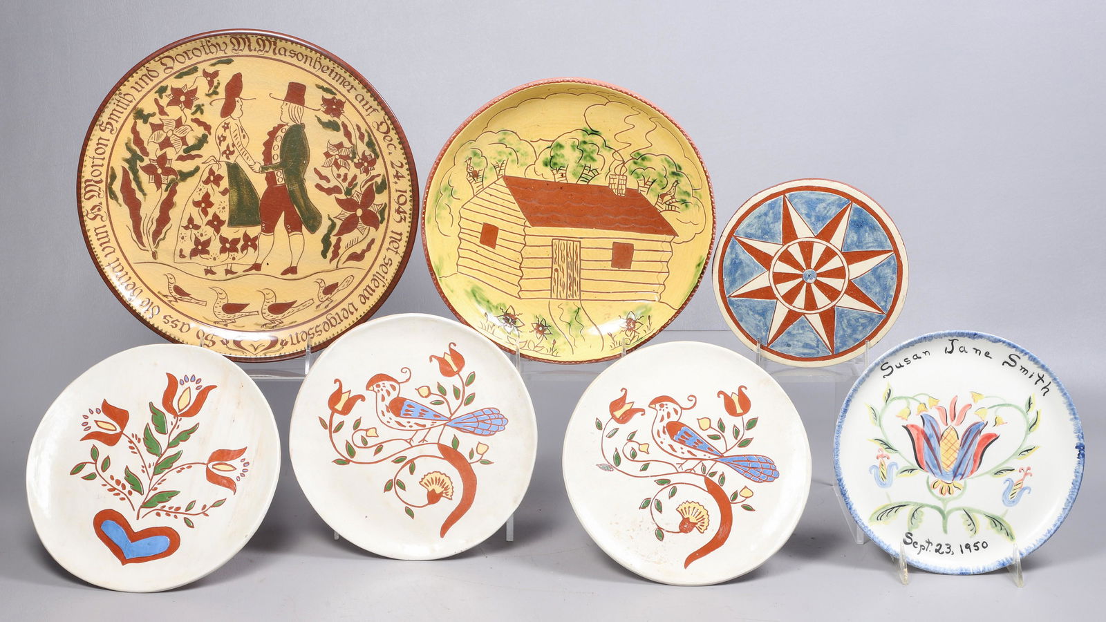 (7) Redware and Style Articles: (7) Redware and style articles to include redware trivet, 6-5/8" dia, (1) Russel Wright painted plate in folk style, 8-1/4" dia, (3) sgraffito plates in folk design signed Bobby at back, (1) breininge