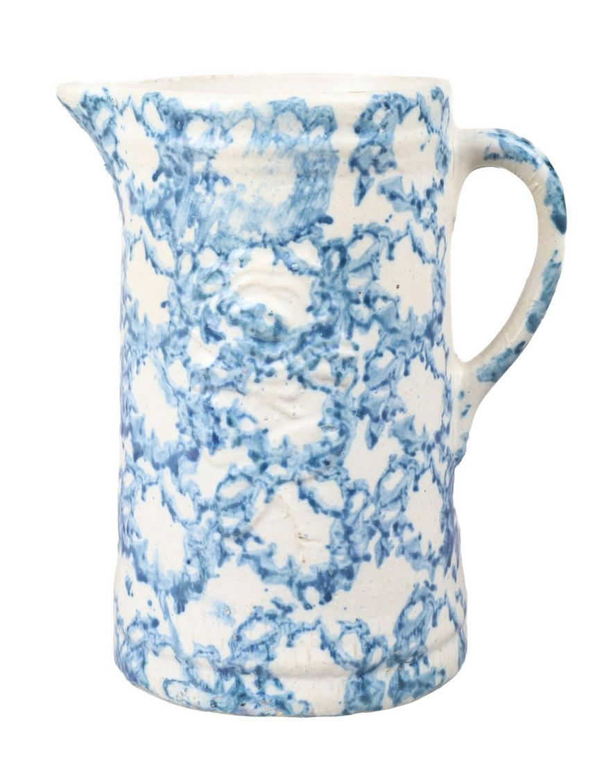 Sponged Stoneware Rose Jug: Sponged stoneware rose jug, stoneware handled jug in sponge painted decoration with rose at front, 9"H, flake at inner rim near spout.