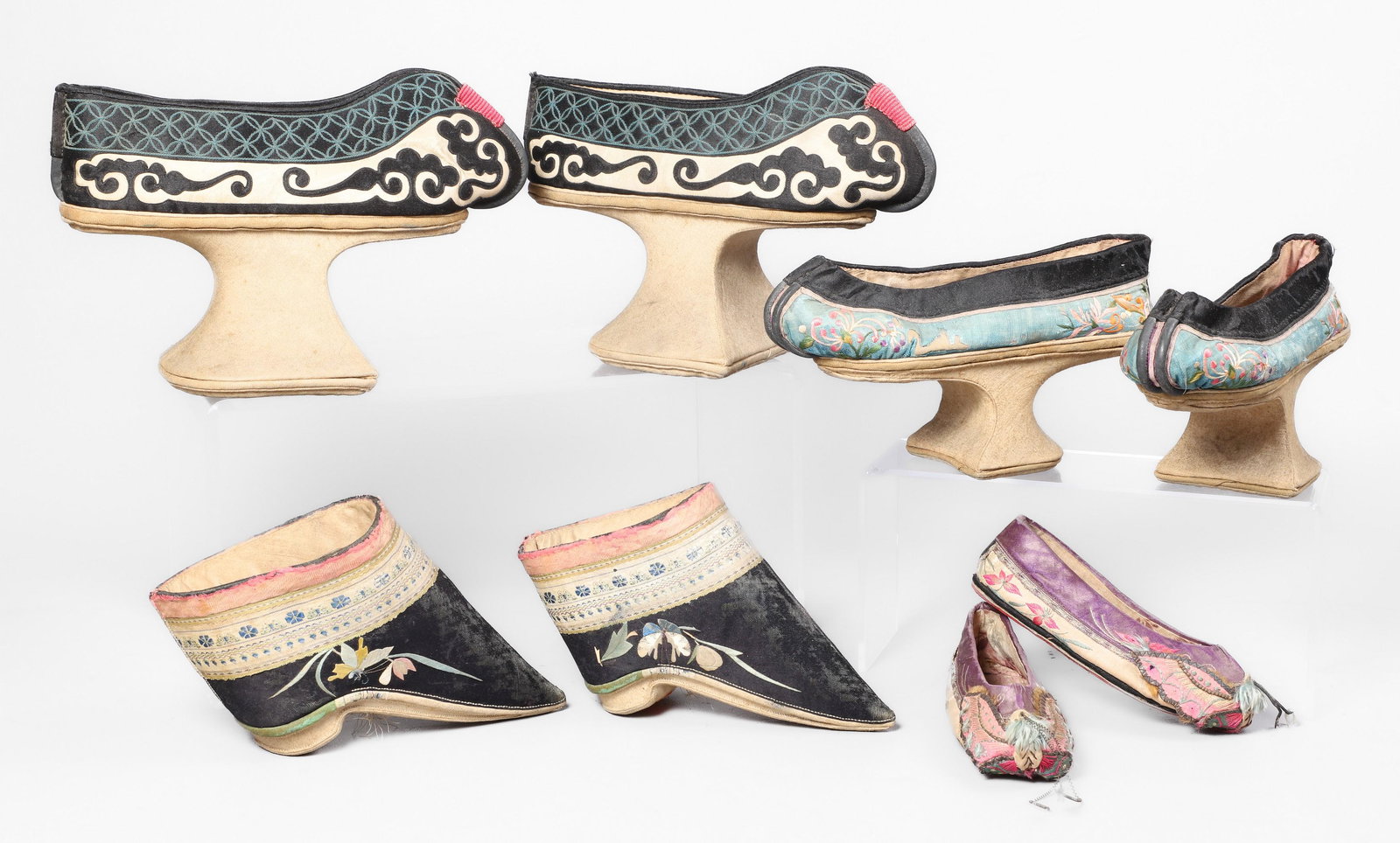 (4) Pair Chinese Shoes: (4) Pair of Chinese shoes, c/o Manchu platform shoes with applied applique decoration (3-1/2" h heels, 9-1/2" l x 6" h overall), Manchu platform shoes with embroidered floral decoration (2-1/2" h heel