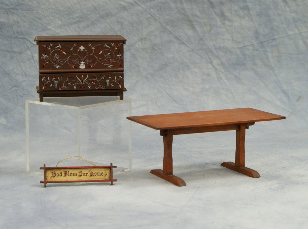 3 pc miniature furniture, consisting of 1 hangin: 3 pc miniature furniture, consisting of 1 hanging "God Bless Our Home" sign by George Schlosser, 1 table signed NH, and a hand painted blanket chest signed B, tallest 2-3/4" high