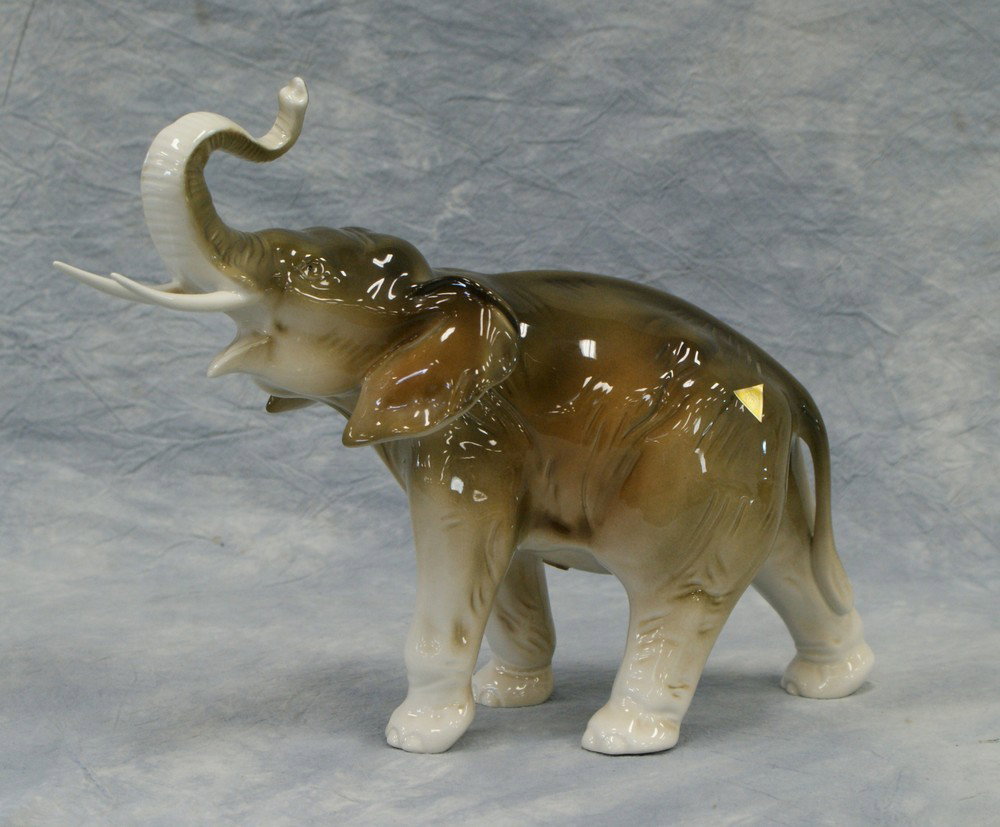Royal Dux porcelain elephant made in Czech Republ: Royal Dux porcelain elephant made in Czech Republic Hand painted R with circle on bottom, A+ on foot, 378/3 82 LP gold seal on left hind quarter stating Royal Dux, 10" tall, no box