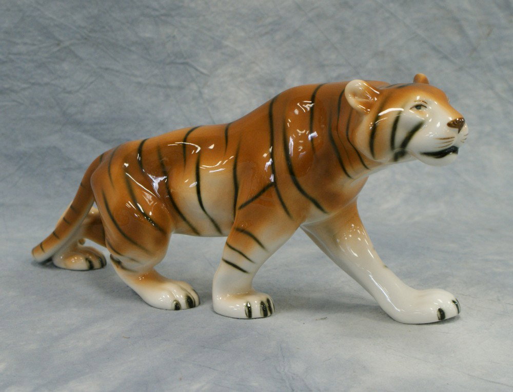 Royal Dux porcelain Tiger figurine, gold triangle: Royal Dux porcelain Tiger figurine, gold triangle Dux sticker on top and pink symbol on bottom and R in circle on bottom, round stamped made in Czech republic, 312 45 18 marked A+ on foot bottom, 6 1/