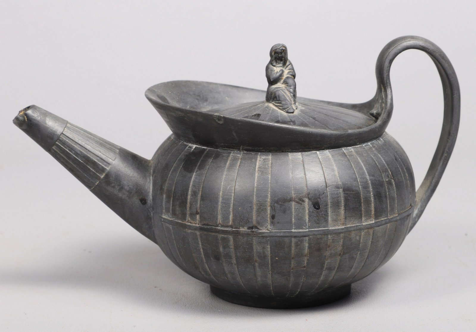 Wedgwood Basalt Teapot: Wedgwood basalt teapot, figural finial, 4-5/8" h, major chip to spout