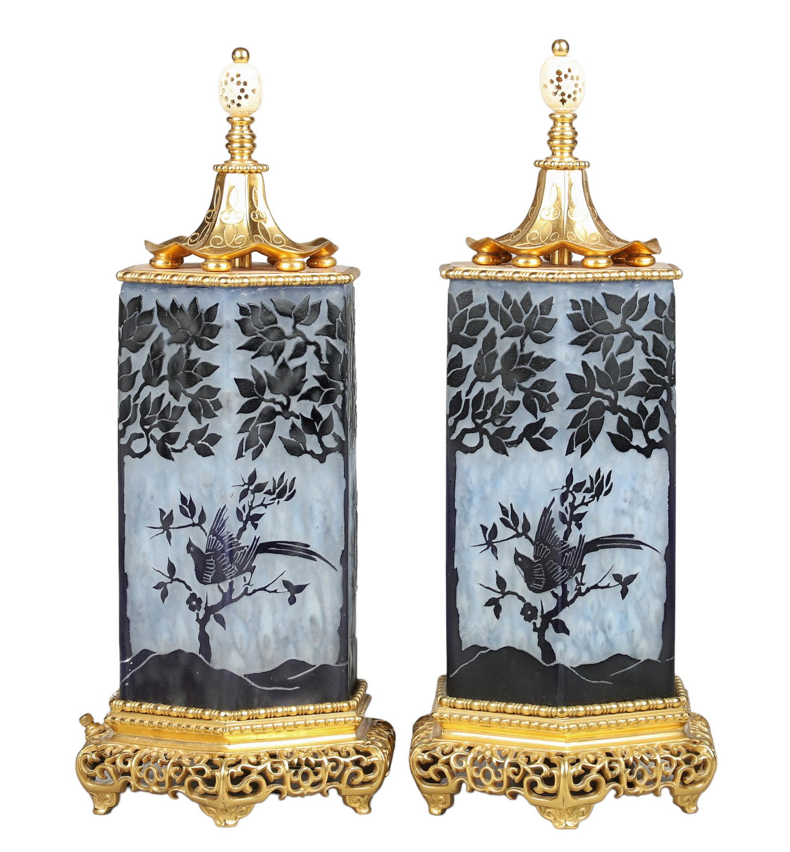 Pair of Asian Style Cameo Glass Table Lamps: Pair of Asian style cameo glass table lamps, birds & trees, reticulated brass base, brass pagoda top with pierced bone finial, unmarked, 18" h