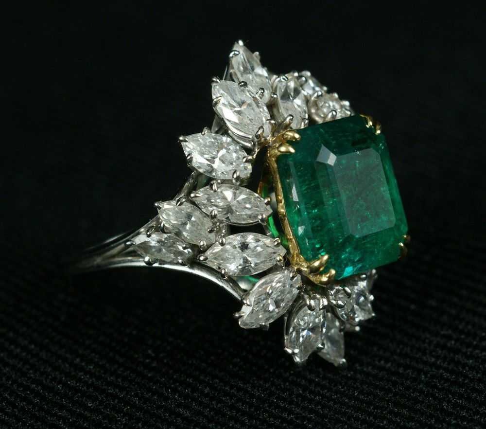 Platinum and 18K YG ladies emerald and diamond ri: Platinum and 18K YG ladies emerald and diamond ring, center stone a octagonal step cut natural emerald of Colombian origin, measuring 10.75 mm x 9.6 mm, weighting 4.79 carats, displays liquid filled a