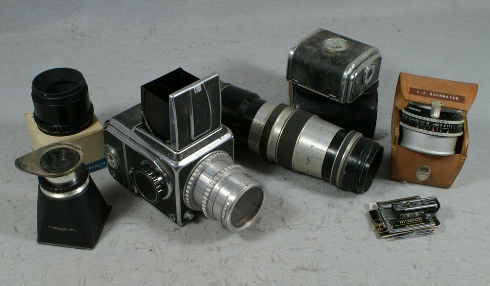 Hasselblad camera model 1600F with 80mm F2.8 Koda: Hasselblad camera model 1600F with 80mm F2.8 Kodak Ektar lens (SN ET2964, c 1949), SN CH 12082, film magazine with SN CH13464. This camera was made in 1952. This model was produce from 1948 until 1953