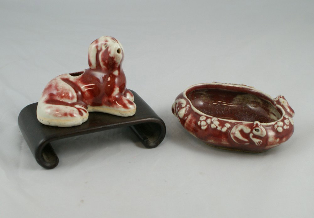 (2) pcs of Chinese Sang De Boeuf, including a bru: (2) pcs of Chinese Sang De Boeuf, including a brush washer with squirrels, circa 1900, together with a dog shaped water dropper, circa 1900, widest 5"