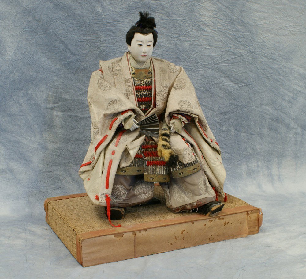 Japanese Eggshell Lacquered Face Samurai doll and: Japanese Eggshell Lacquered Face Samurai doll and stand, 19th century, overall height approx 18.5" high, with losses