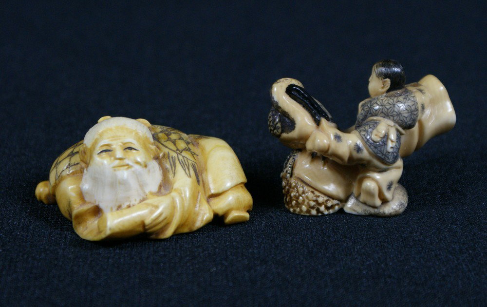 2 carved ivory netsuke, reclining bearded figure: 2 carved ivory netsuke, reclining bearded figure, boy with pelican, artist signed, 1 3/4"- 2" long, sold subject to ivory export/import laws, we will not ship any ivory to California