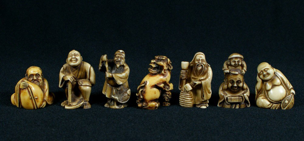 (7) ivorine netsuke, foo dog & 6 men, about 1 3/: (7) ivorine netsuke, foo dog & 6 men, about 1 3/4" h, sold subject to ivory export/import laws, we will not ship any ivory to California