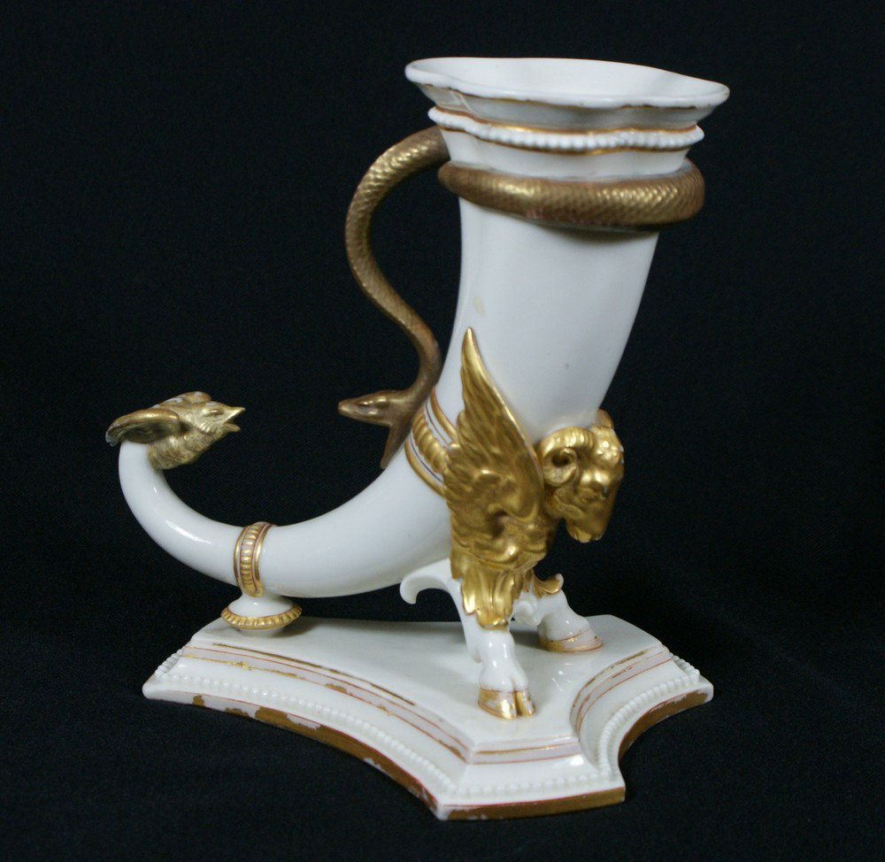 Royal Worcester Cornucopia form Porcelain Vase, t: Royal Worcester Cornucopia form Porcelain Vase, the body entwined with serpent and supported by mythological beast, the tails in the form of birds, raised on tri-form bases, impressed, Worcester crown