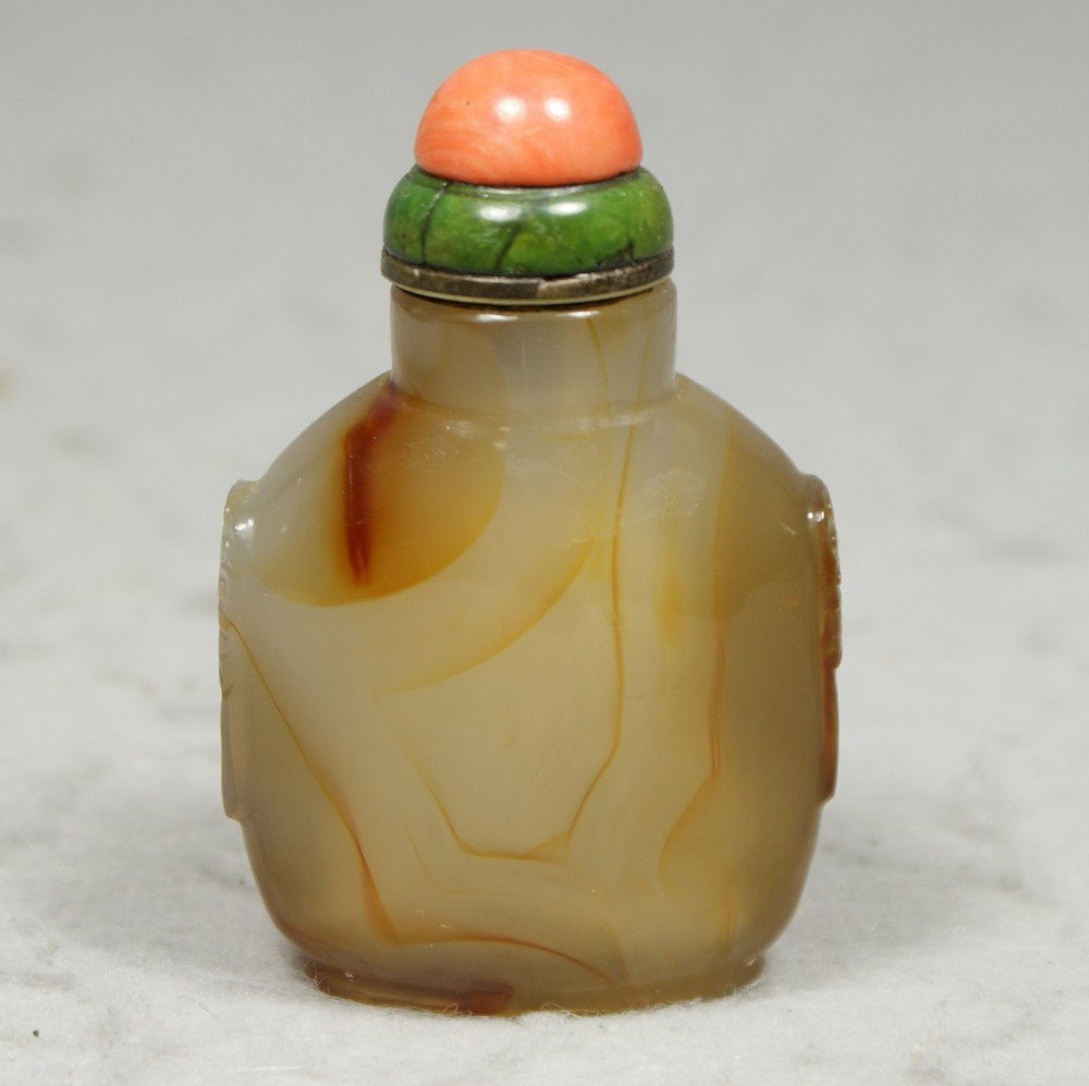 Agate snuff bottle with green: Agate snuff bottle with green stone, coral stopper and lion mask handles, 3 1/4" tall