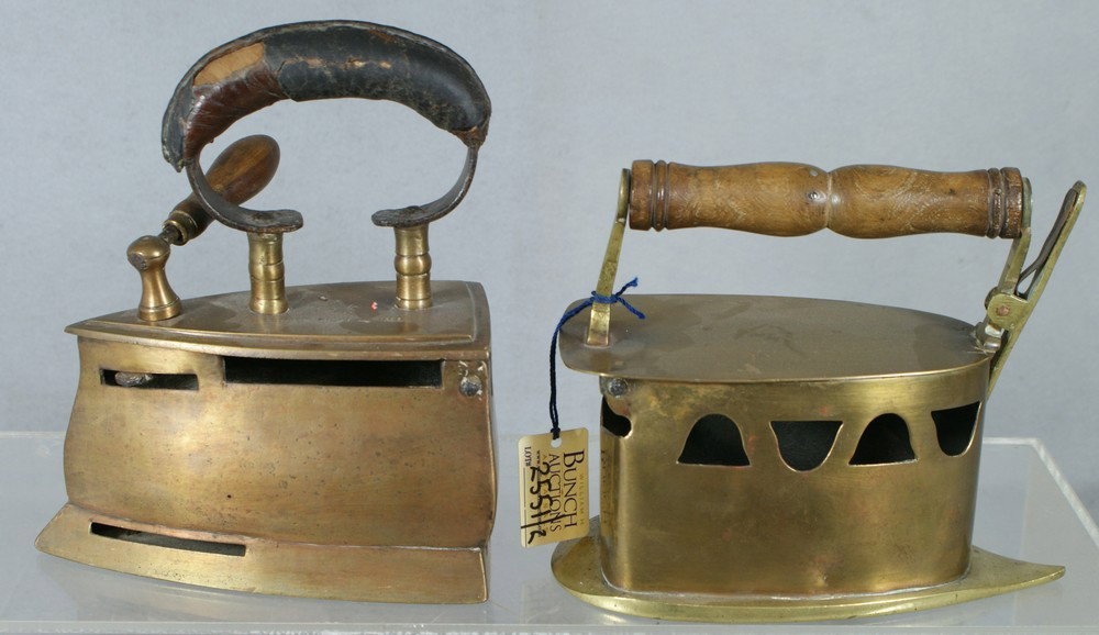 (2) brass charcoal irons with hinged tops, one a : (2) brass charcoal irons with hinged tops, one a wood handle the other leather & iron