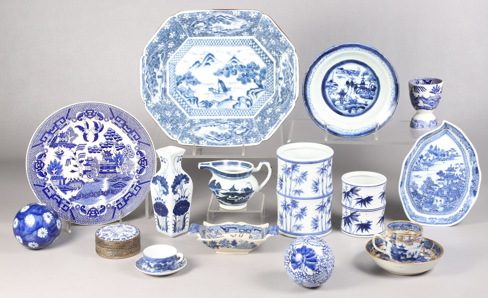 Lot of Asian Blue & White Porcelain: Lot of Asian blue & white porcelain, including (2) carpet balls, hognose creamer (roughness to rim), Japanese Blue Willow miniature cup & saucer, porcelain shard trinket box, Japanese cut corner servi