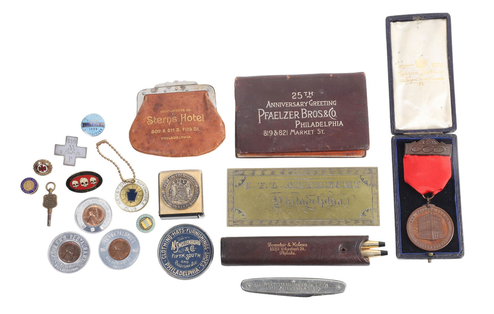 Lot of Philadelphia Advertising Items: Lot of Philadelphia advertising items, including Pfaelzer Bros & Co 25th Anniversary leather ledger, Stern's Hotel leather purse, Bonschur & Holmes leather case with Cross gold filled pen & pencil set