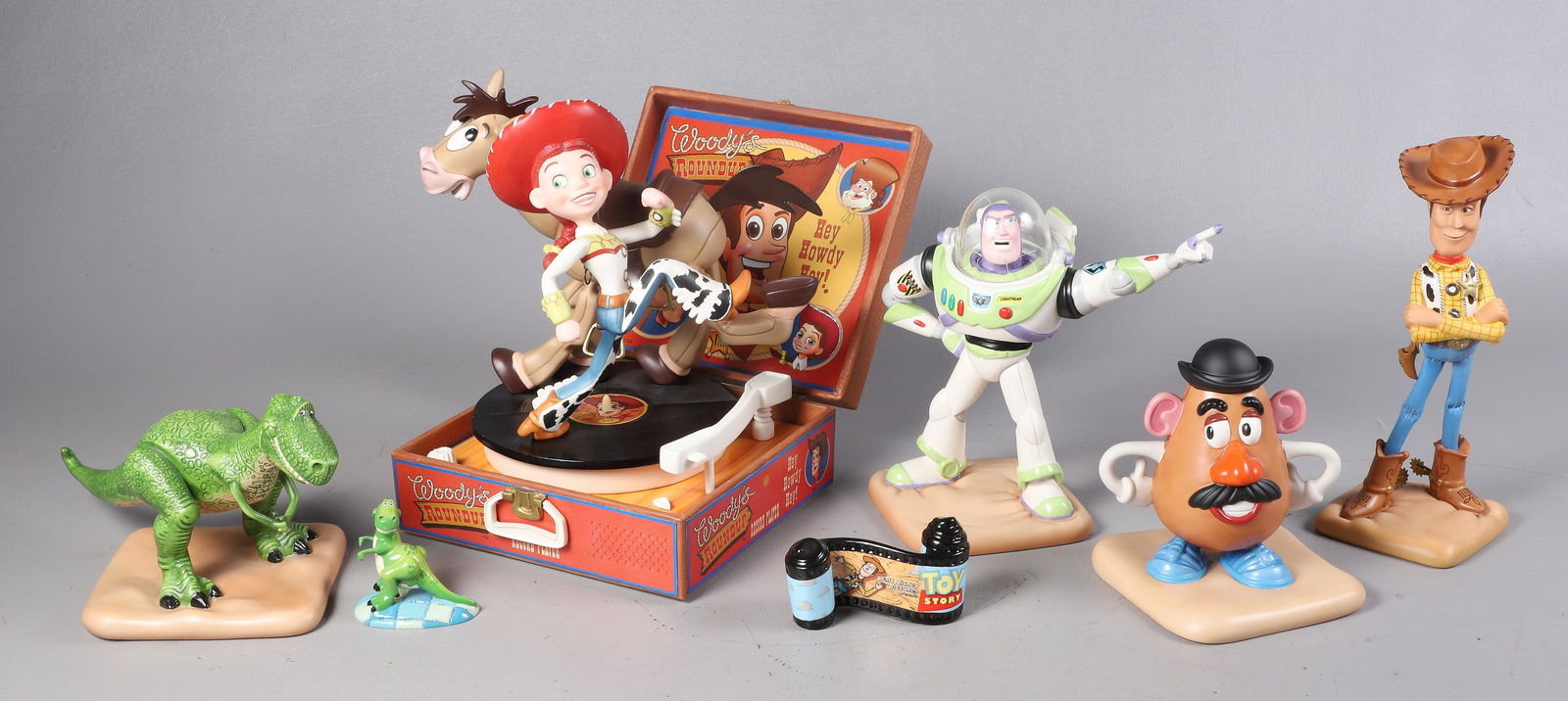 Lot of Disney Toy Story Figures: Lot of Walt Disney Classic Collection Toy Story & Toy Story 2 porcelain figurines, c/o Buzz Lightyear "To Infinity and Beyond" (6-1/2" h), Woody "I'm Still Andy's Favorite Toy" (7-1/2" h), Rex "I'm So