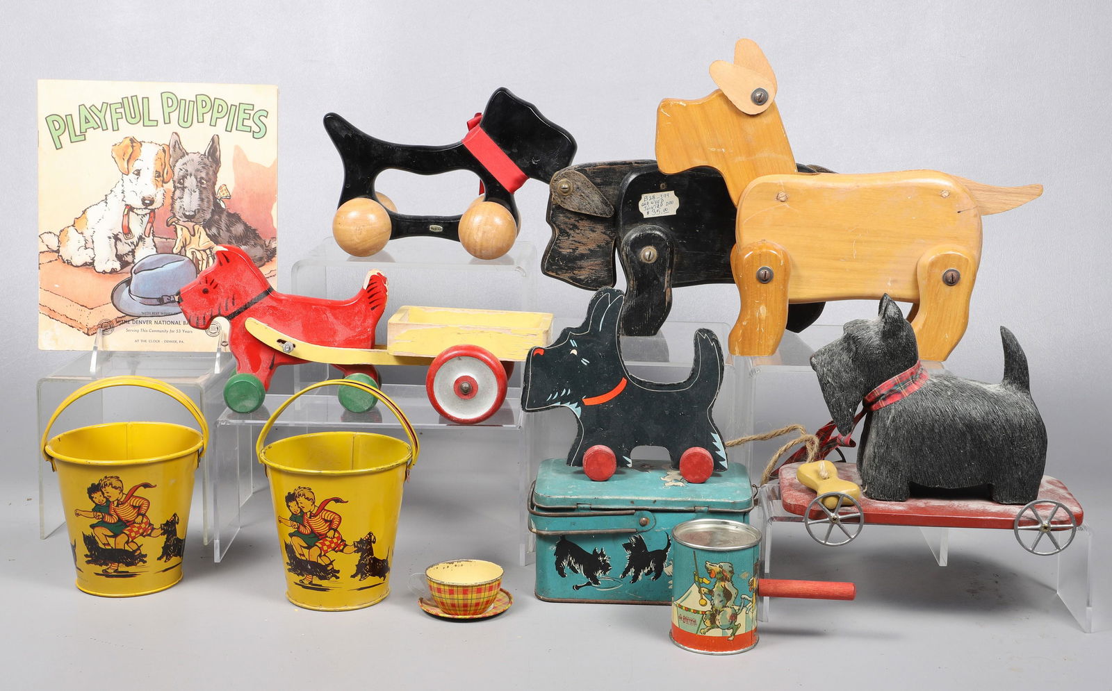 Lot of Scottie Toys: Lot of Scottish Terrier (Scotty) dog toys, including 1993 RSVP pull toy, (2) Kirchhof tin litho buckets, tin litho lunch pail, Barone tin litho noisemaker, J Chein & Co tin litho childs teacup & sauce