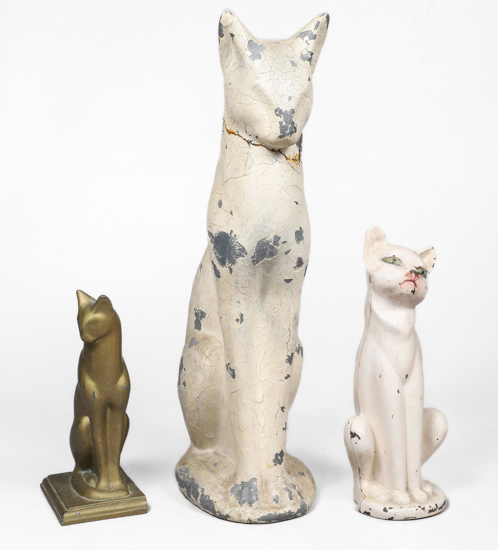 (3) Stylized Siamese Cat Doorstops: (3) Stylized Siamese cat doorstops, c/o white painted spelter (17-1/4" h, repair to neck), cast iron (10" h), gilt metal (8" h)