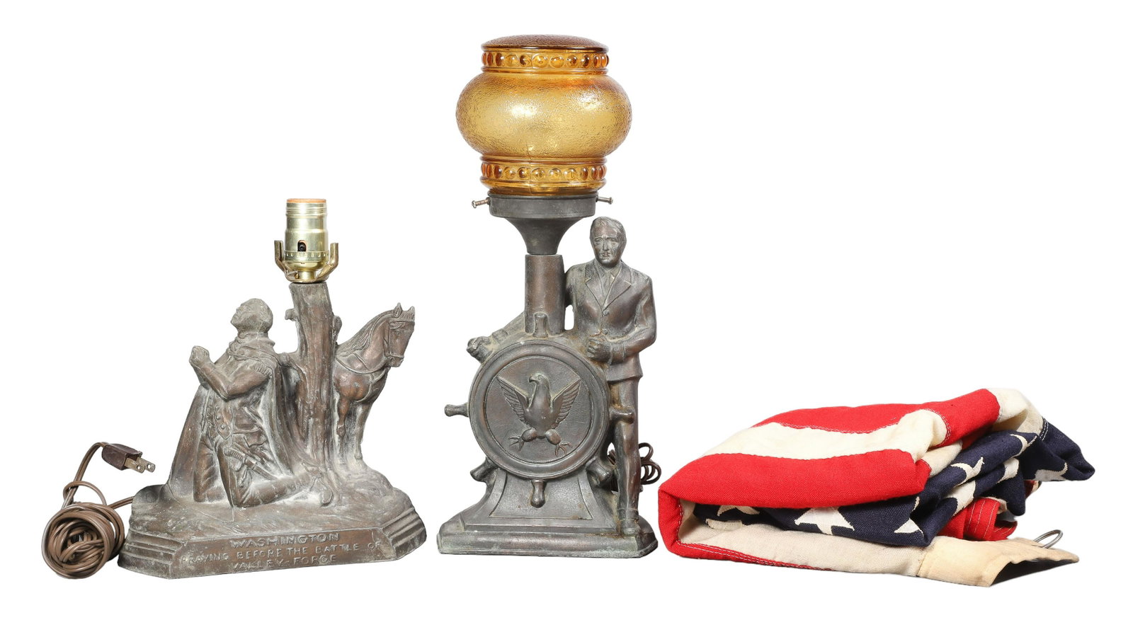 A Spelter Lamp Pair and Flag, Including Washington: A Spelter lamp pair and flag, including Washington, a cast lamp body depicting Washington praying before the battle of Valley Forge, 11-1/4"H along with FDR spelter lamp with pressed amber shade, 15-3