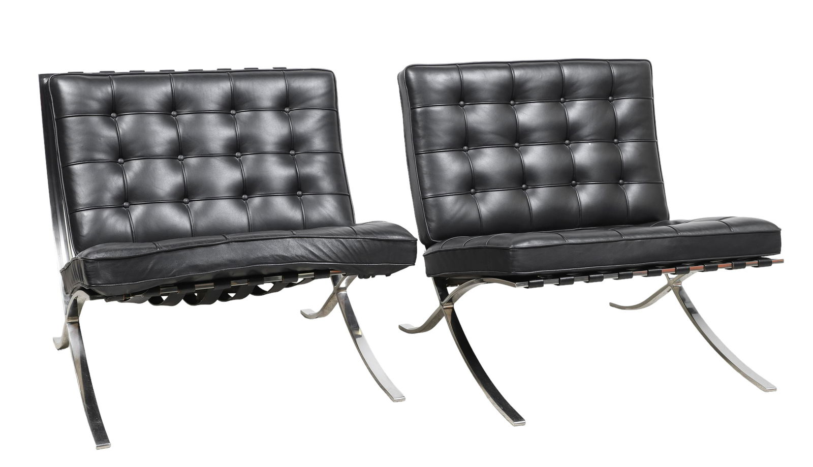 Pair Mies Van Der Rohe for Knoll Barcelona chairs: Pair Mies Van Der Rohe for Knoll Barcelona chairs, chrome frames, black tufted leather cushions, Knoll tag on base, 31"h x 29"w