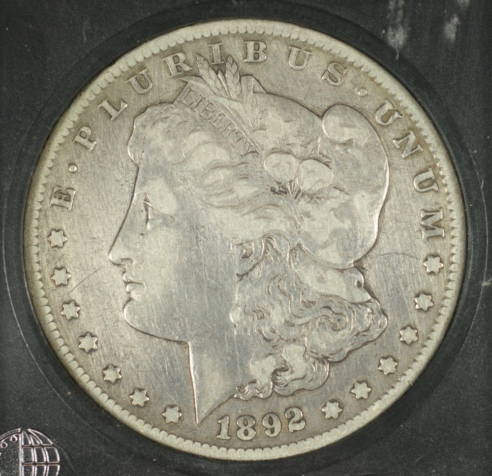 1892cc Morgan Dollar in a coin world slab graded : 1892cc Morgan Dollar in a coin world slab graded (correctly) F/VF