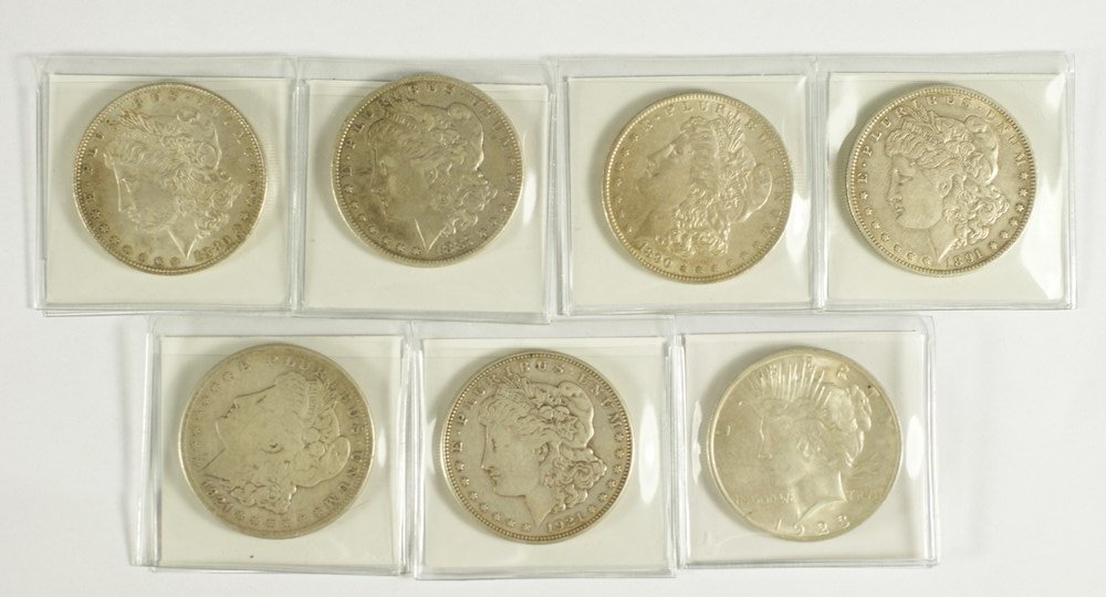 7 Morgan or Peace dollars G/EF comprised of 4 pre: 7 Morgan or Peace dollars G/EF comprised of 4 pre-1921 Morgans, (2) 1921 Morgans and one 1923 Peace dollar.