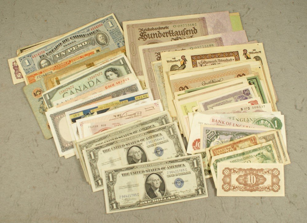 About 115 worldwide currency notes in a cigar box: About 115 worldwide currency notes in a cigar box worn/GU including 4 1935 $1. silver certificates, Notgeld and German inflation notes, obsolete Great Britain 5 pound and several one pound notes, othe